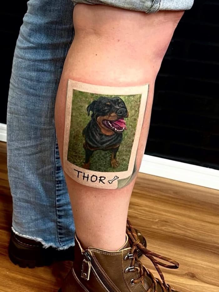 Realistic black and grey dog portrait tattoo by Ramon Vicente