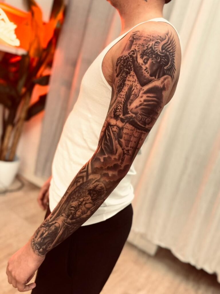 Full sleeve black and grey realism tattoo with Greek statues by Yago Sousa
