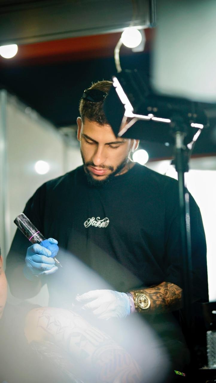 Yago Sousa, realism and cover-up tattoo artist, working in studio
